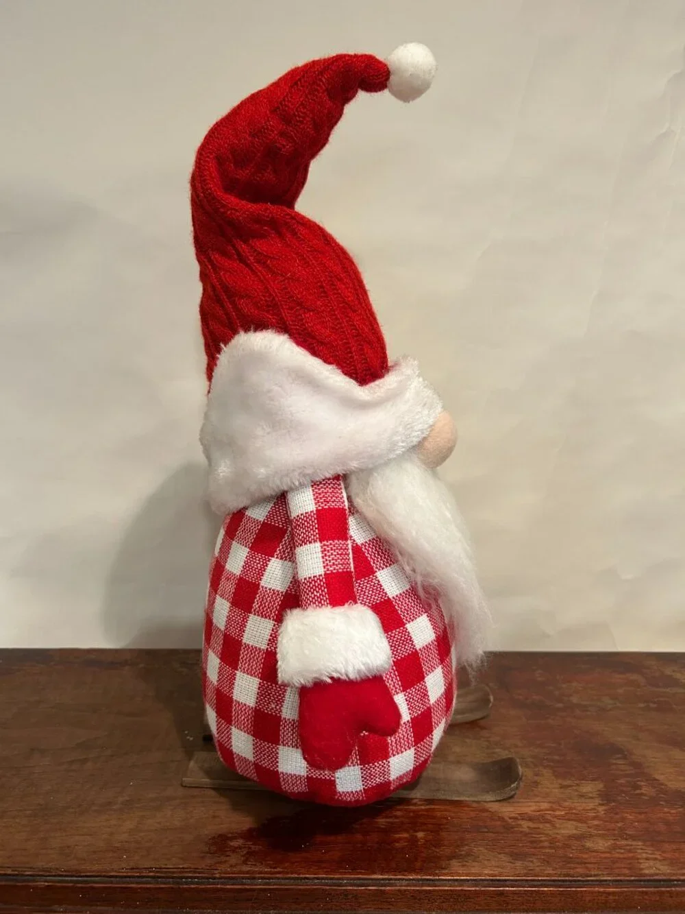 Christmas Holiday Gnome with red knit cap, red plaid torso, wispy white beard